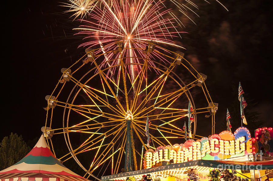 Evergreen State Fair with ferris wheel and fireworks display Photograph