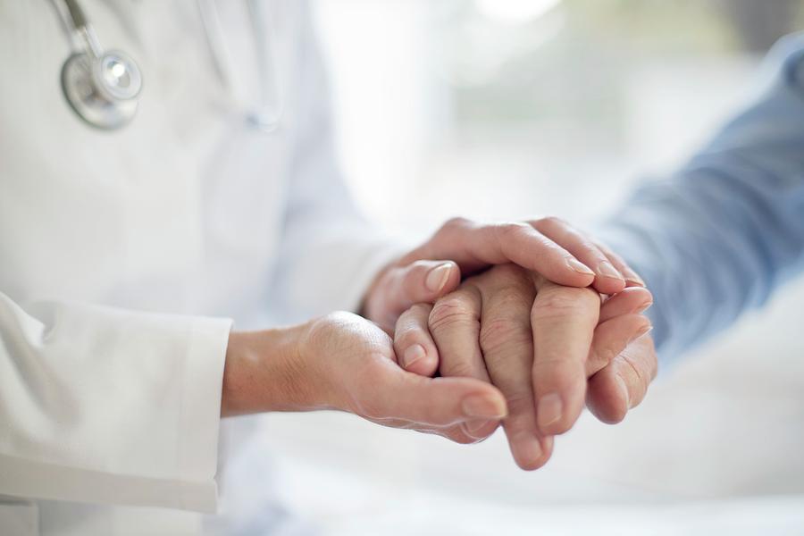 Female Doctor Holding Patient's Hand Photograph By Science Photo 