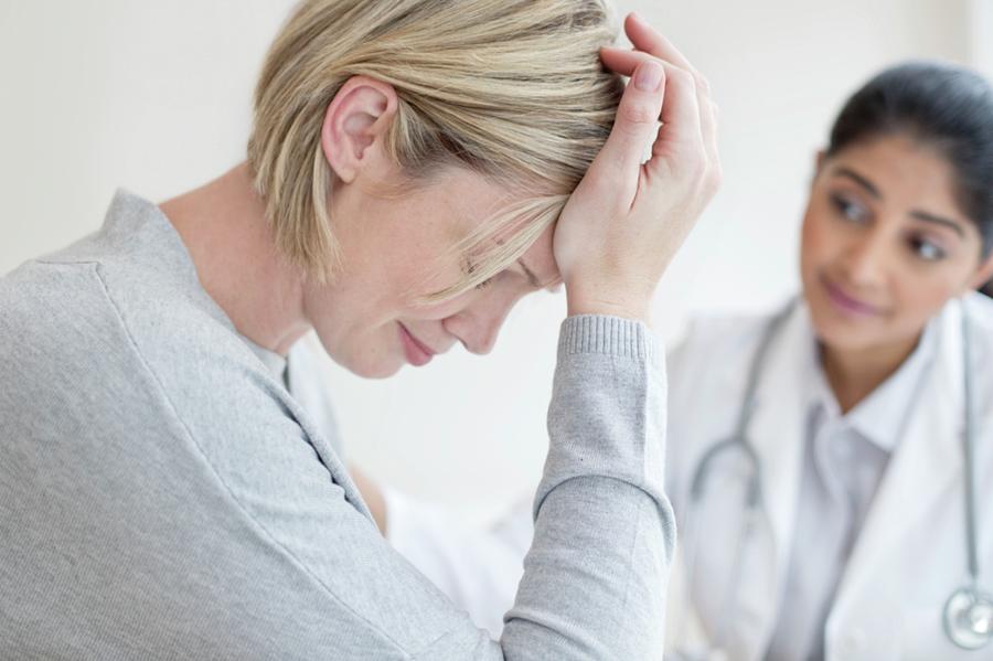 Female Doctor Listening To Patient Photograph By Science Photo Library