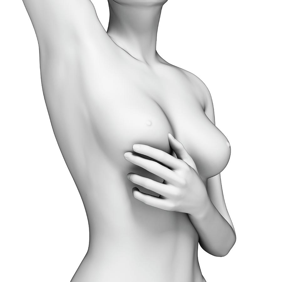 Female Examining Her Breast #1 Photograph by Sebastian Kaulitzki