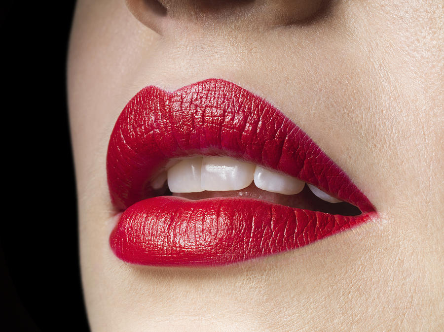 Female lips with red lipstick on, perfect teeth #1 Photograph by Jonathan Knowles