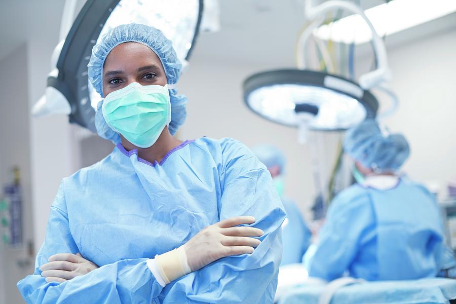 Female Surgeon In Scrubs And Mask #1 Photograph By Science Photo 