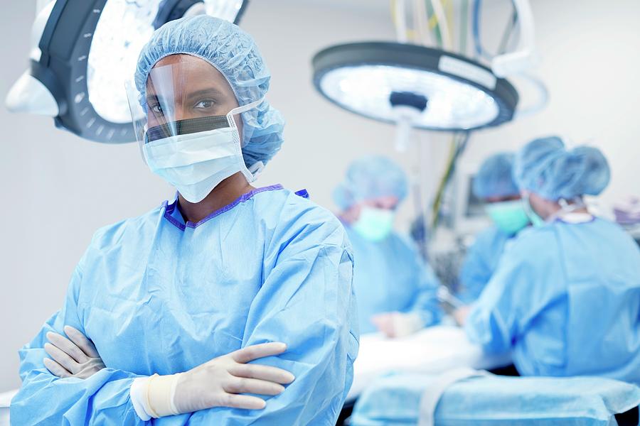 Female Surgeon Wearing Mask And Visor Photograph by Science Photo ...