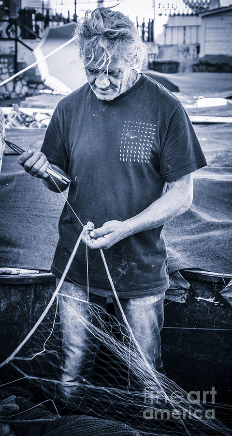 fisherman mending nets on Anzio harbour #2 Photograph by Peter Noyce
