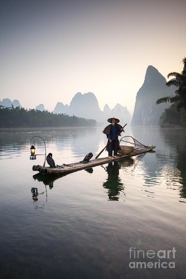 Fisherman with cormorants on the Li river near Guilin China #1 Photograph by Matteo Colombo