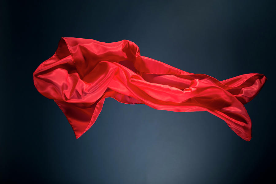 Floating Red Satin On A Dark Blue #1 Photograph by Gm Stock Films