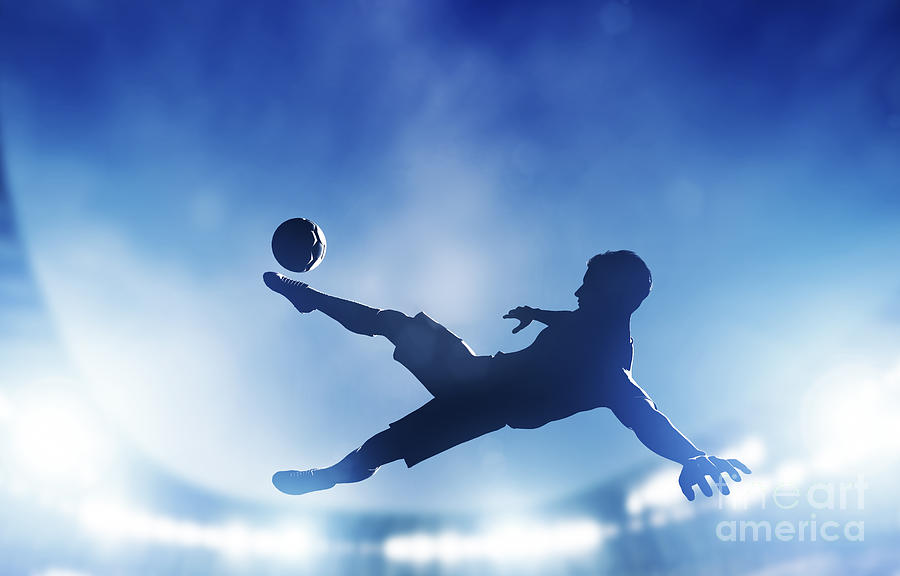 Football Photograph - Football soccer match A player shooting on goal #1 by Michal Bednarek