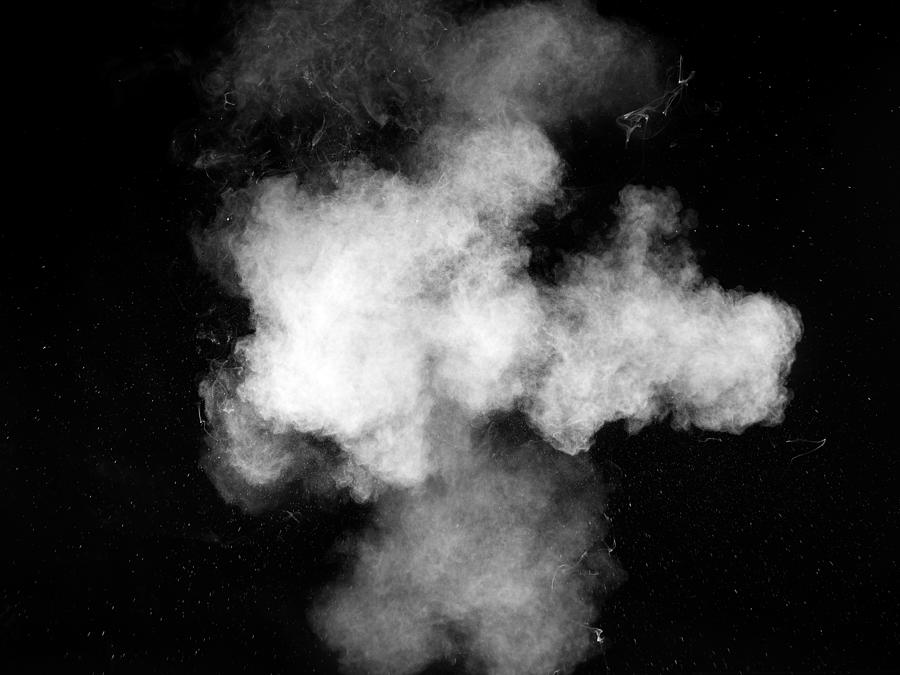 Forms and textures of an explosion of a powder of color white on a  black background #1 Photograph by Jose A. Bernat Bacete