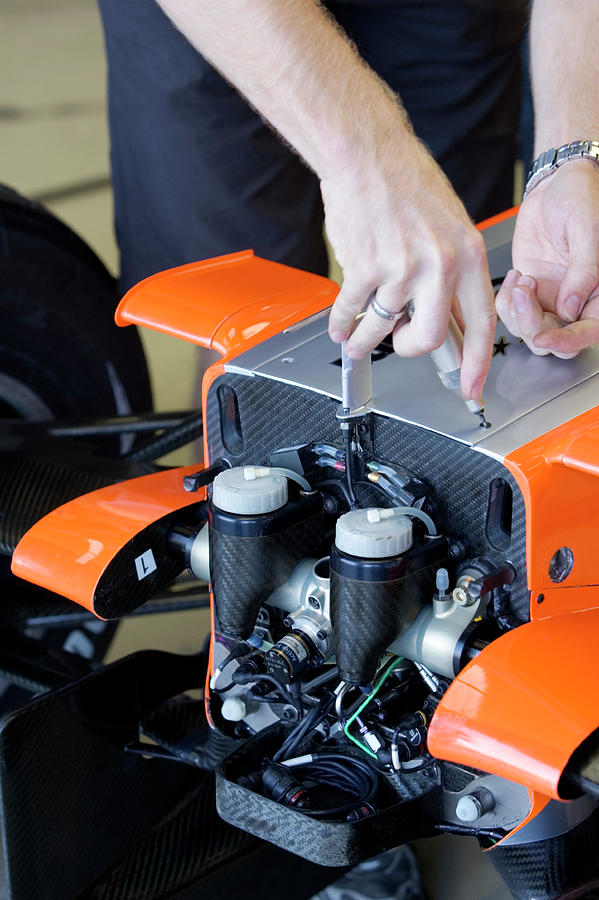 Formula One Car Preparation Photograph by Gustoimages/science Photo ...