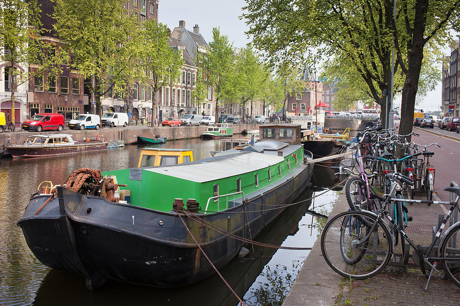 Geldersekade Canal in Amsterdam #1 Photograph by Artur Bogacki