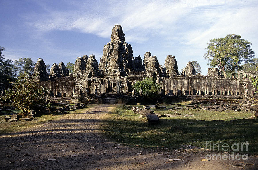 Gigantic face statues at Khmer temple Angkor Wat ruins Cambodi #1 Photograph by Ryan Fox