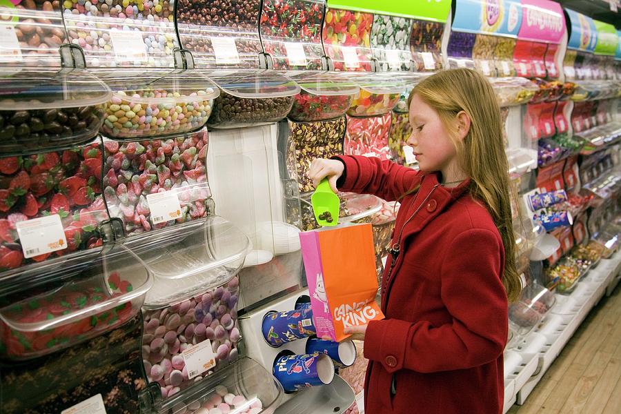 Girl Choosing Sweets Photograph by Mark Thomas/science Photo Library ...