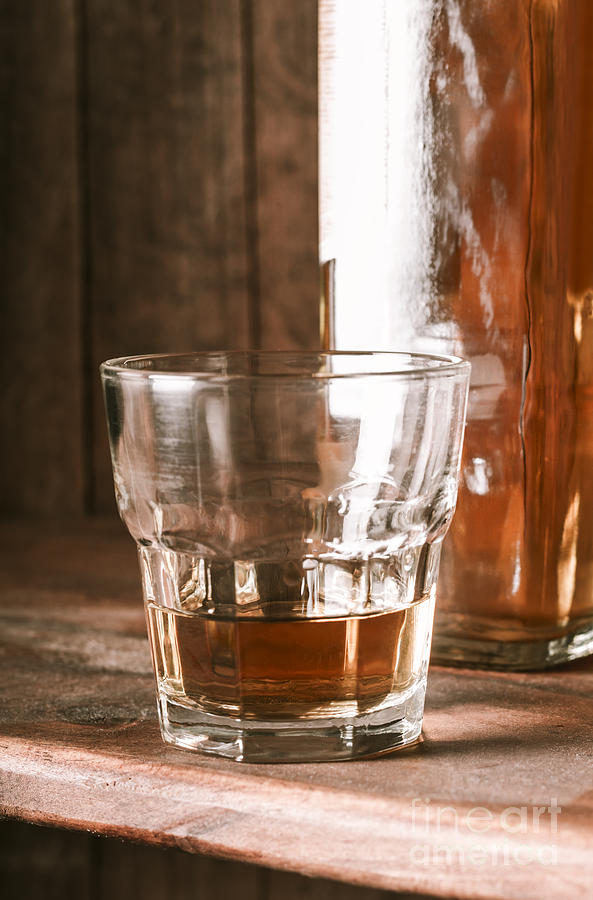 Glass of southern scotch whiskey on wooden table #1 Photograph by Jorgo Photography