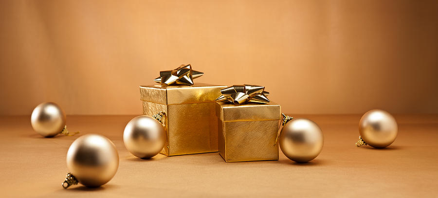 Gold bauble and present #1 Photograph by U Schade