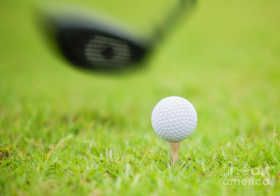 Golf Photograph - Golf ball behind driver at driving range #1 by Anek Suwannaphoom
