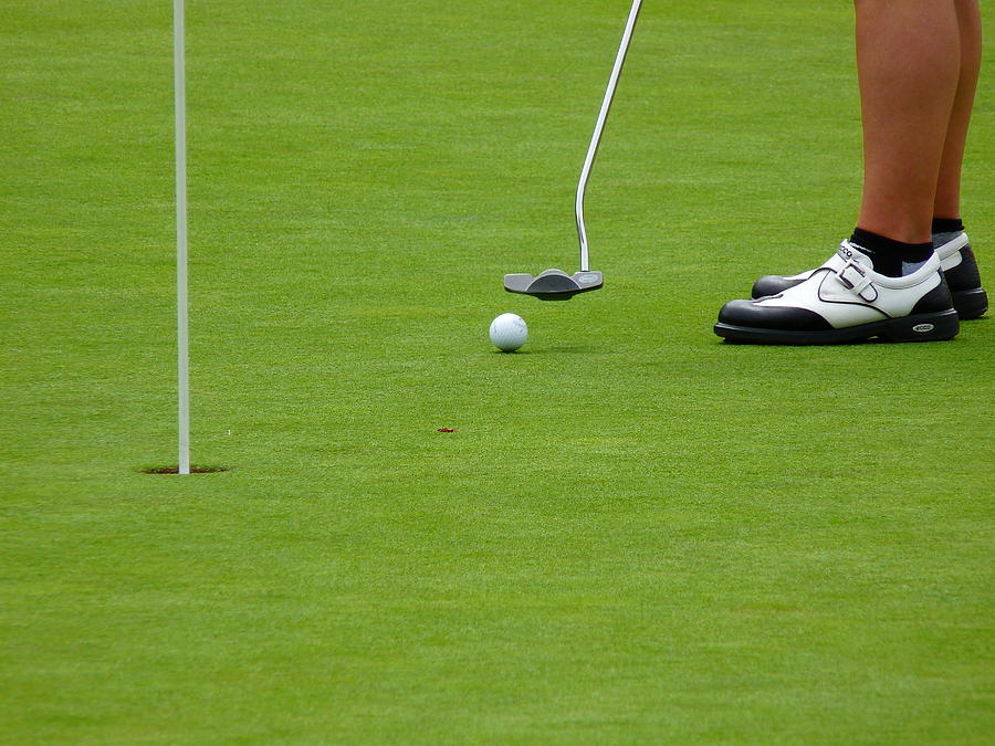 Golfer Putting #1 Photograph by Jeff Lowe