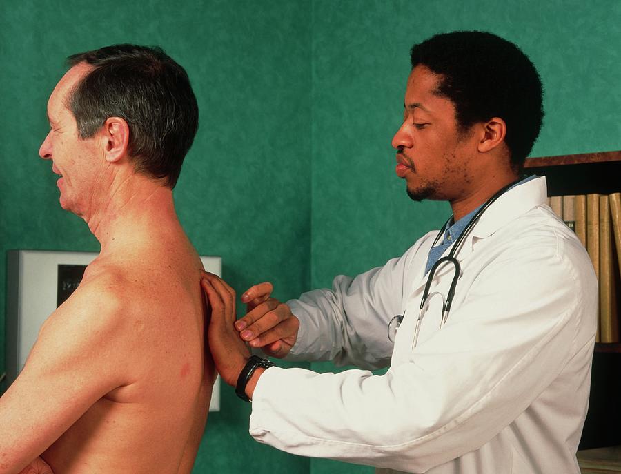 Gp Doctor Performs Percussion Chest Examination #1 by Cc Studio/science  Photo Library