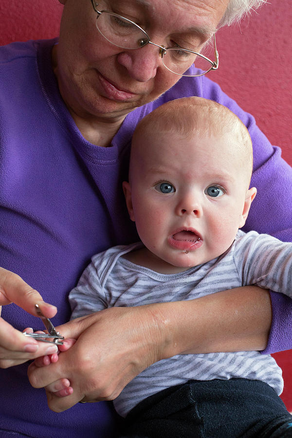 Denver Photograph - Grandmother Cuts Babys Fingernails #1 by Jim West