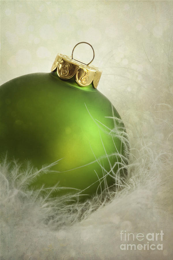 Green christmas ball on soft white feathers #1 Photograph by Sandra Cunningham