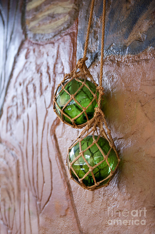 Green Glass Balls Hanging On The Wall  Photograph by Arletta Cwalina
