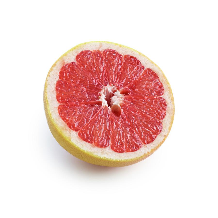 Fruit Photograph - Half A Pink Grapefruit #1 by Science Photo Library