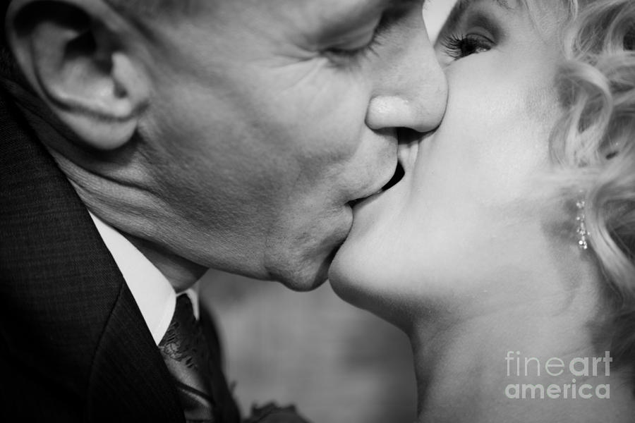 Summer Photograph - Happy bride and groom kissing #1 by Michal Bednarek
