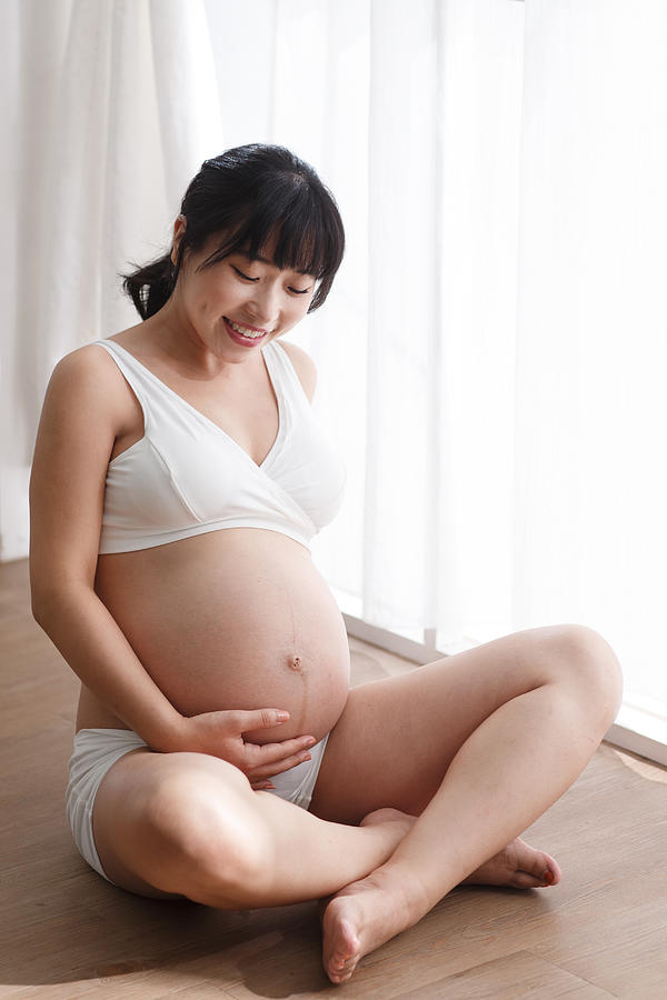 Happy pregnant women #1 Photograph by ViewStock