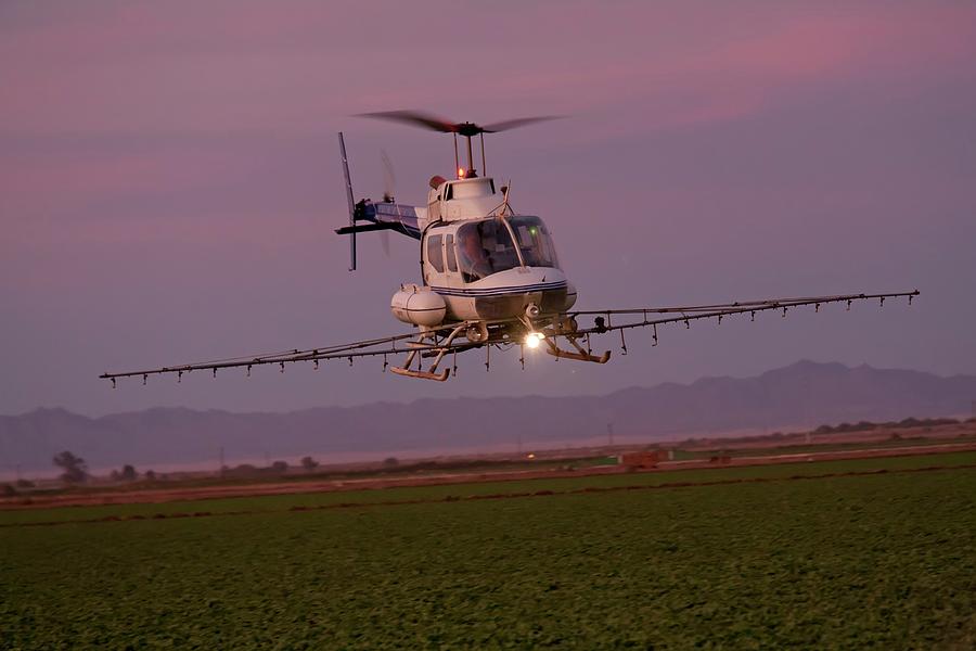 Helicopter Spraying Pesticides #1 Photograph by Jim West