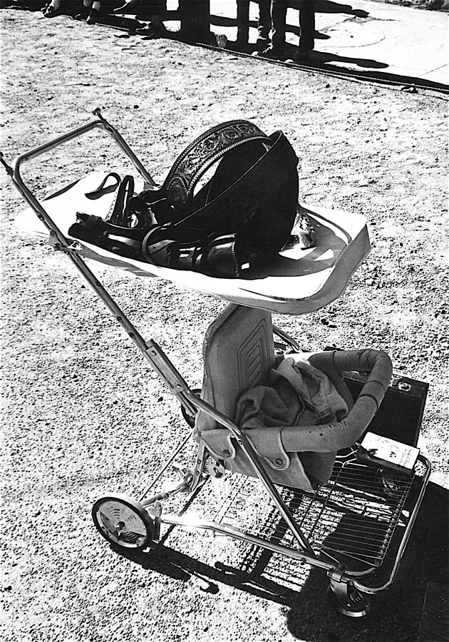 Holster  brief case  baby carriage Tombstone Arizona 1970 #1 Photograph by David Lee Guss
