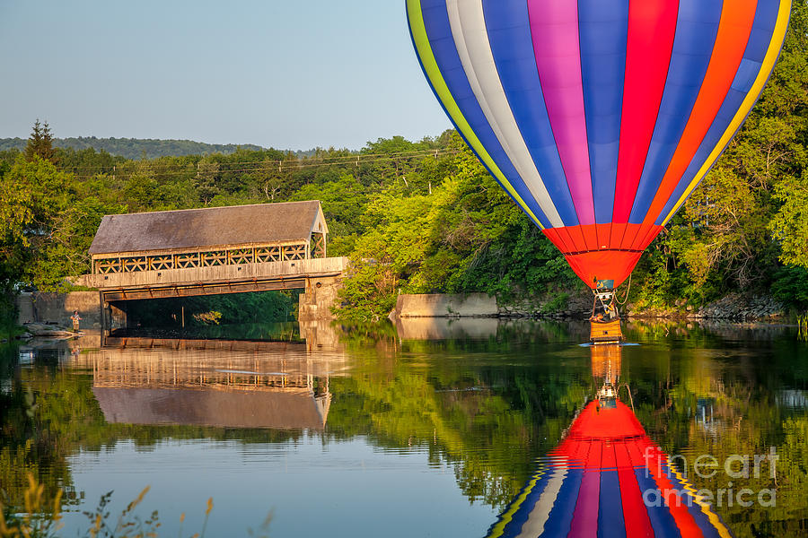 Hot Air Balloon Dipping near the Quechee Covered Bridge #1 Photograph by Susan Cole Kelly
