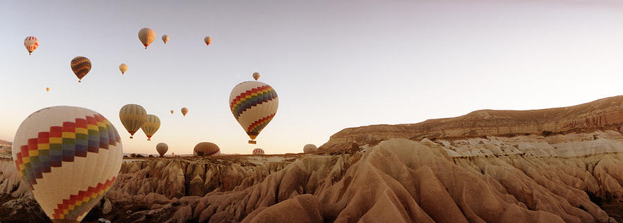 Transportation Photograph - Hot Air Balloons Over Landscape #1 by Panoramic Images