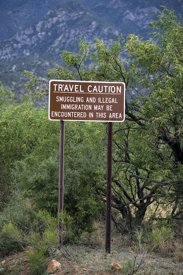 Sign Photograph - Human Smuggling And Illegal Immigration #1 by Mark Newman