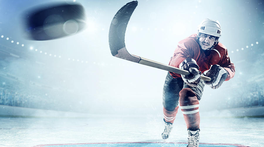 Ice hockey players in action #1 Photograph by Dmytro Aksonov