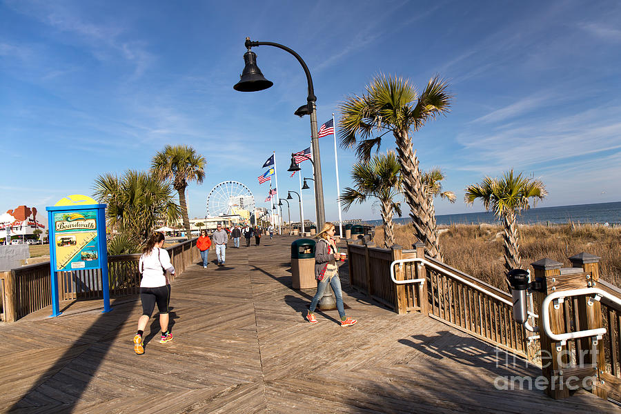Jogging on Boardwalk. #1 Photograph by Robert Loe