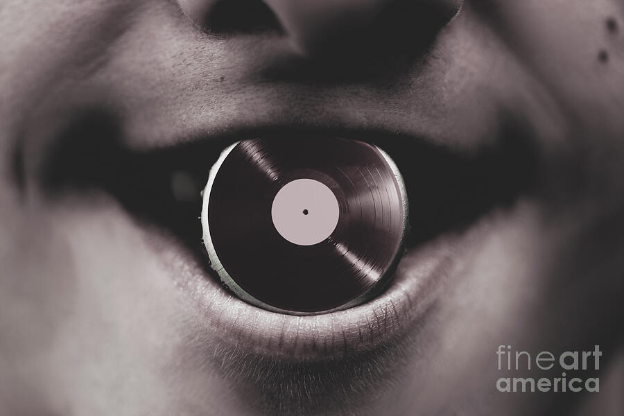 Jukebox DJ holding vinyl soda bottle lid in mouth #1 Photograph by Jorgo Photography