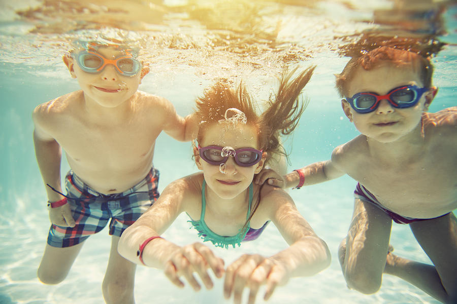 Kids swimming underwater #1 Photograph by Imgorthand