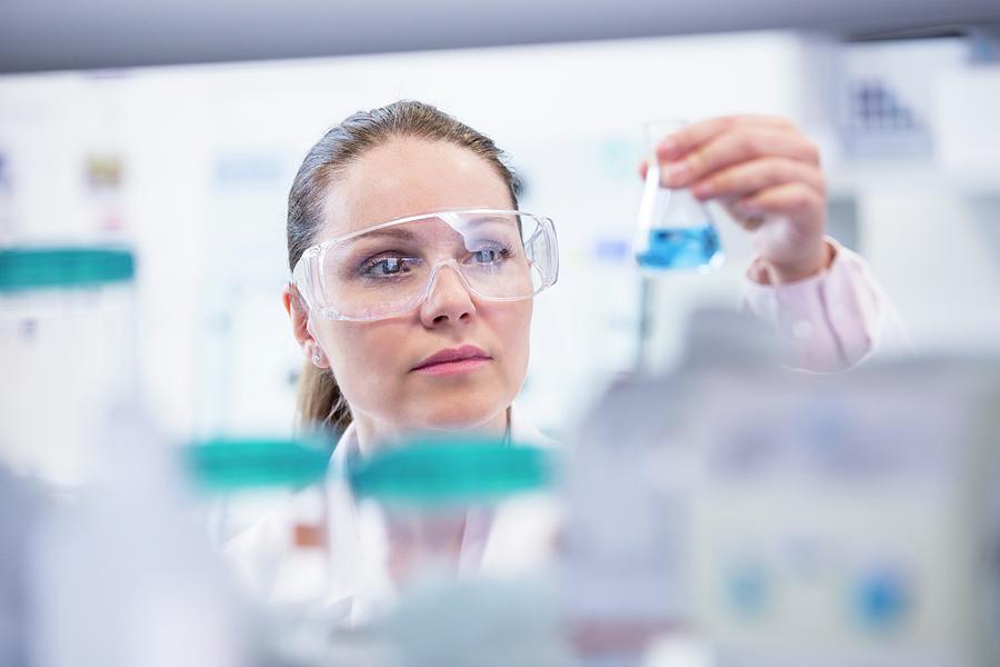 Lab Assistant Holding Chemical Flask Photograph By Science Photo 