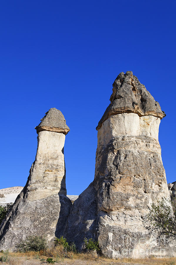Landscape of limestone fairy chimneys at Zelve in Cappadocia Turkey #1 Photograph by Robert Preston