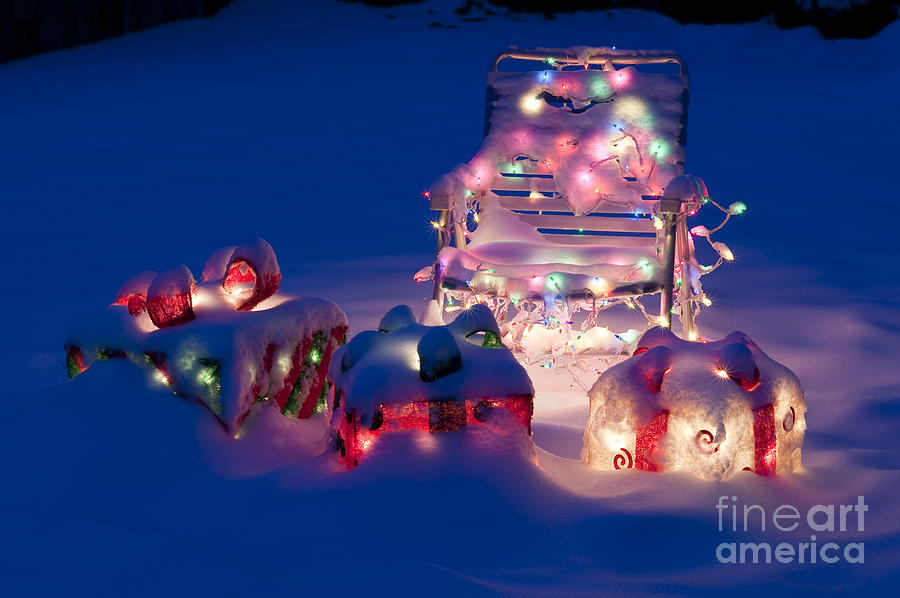 Lawn Chairs with lit Christmas presents #1 Photograph by Jim Corwin