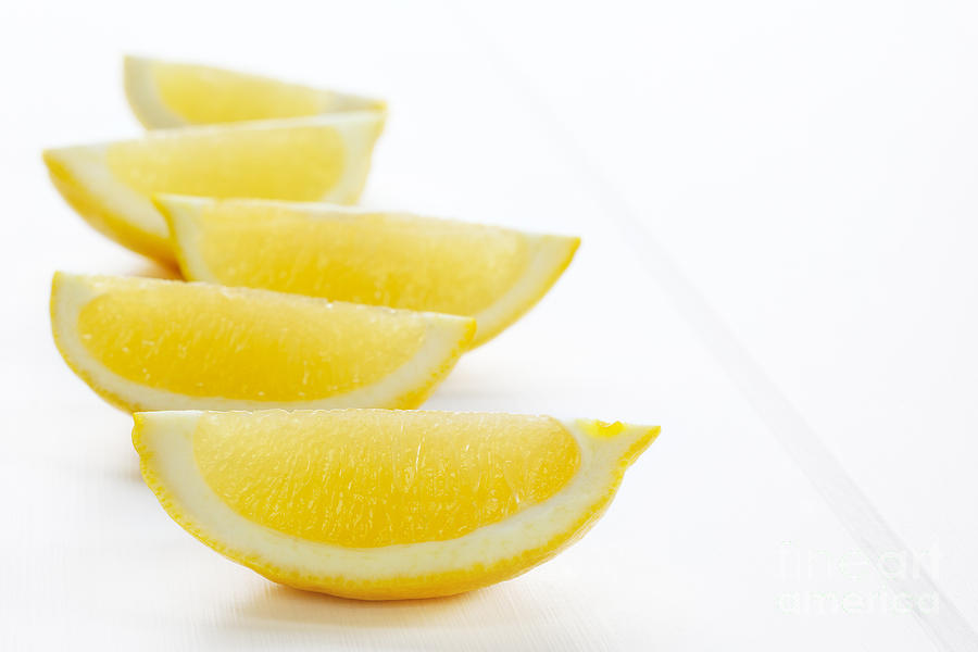 Lemon Photograph - Lemon Wedges on White Background #1 by Colin and Linda McKie