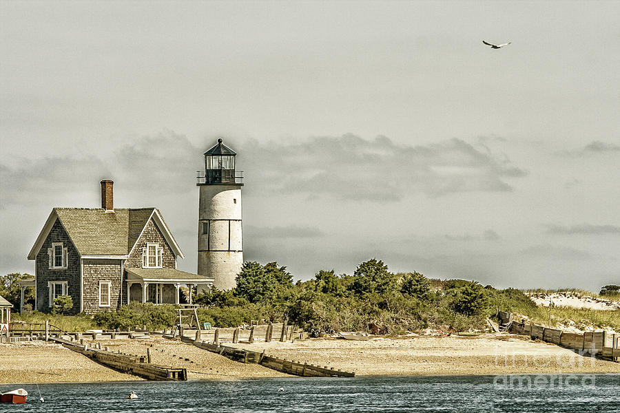 Lighthouse and home at Cape Cod Photograph by Patricia Hofmeester