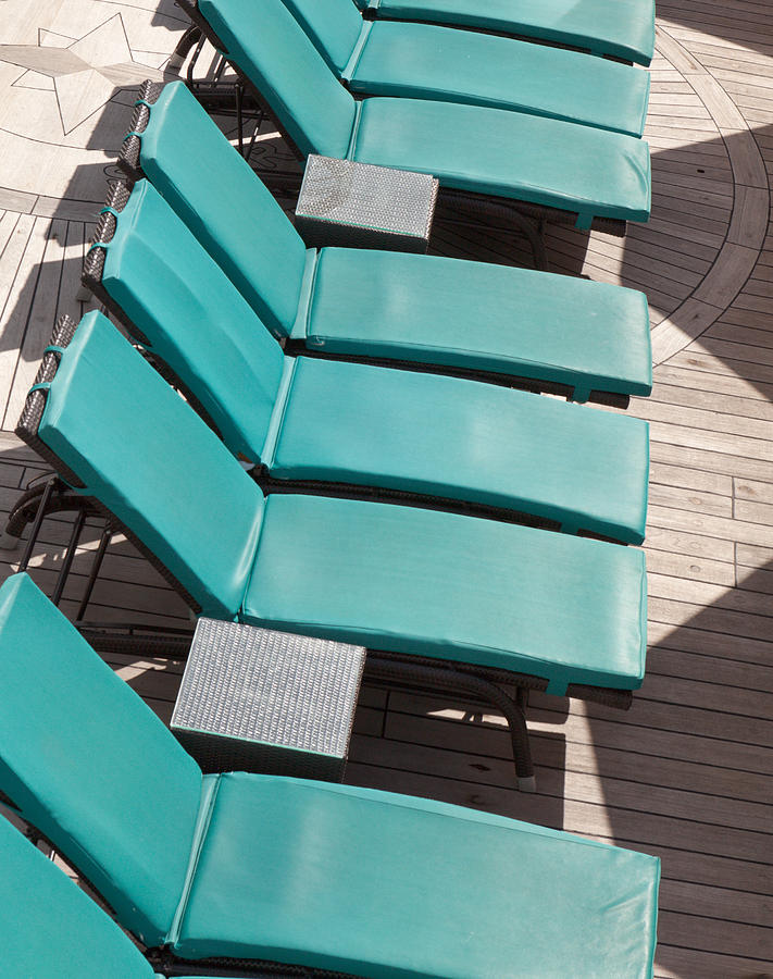 Lounge Chairs on a cruise ship #1 Photograph by Kyle Lee