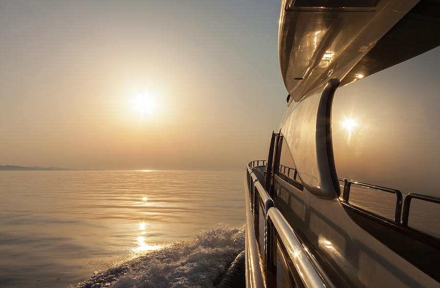 Luxury Motor Yacht Sailing At Sunset #1 Photograph by Petreplesea