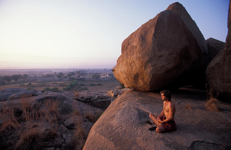 Sunset Photograph - Male Climber Meditating At Sunset #1 by Corey Rich