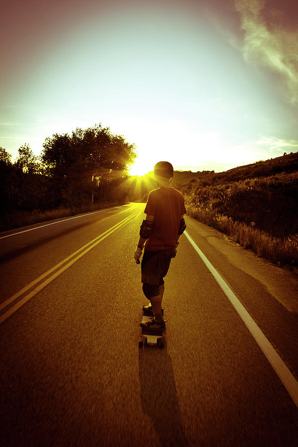 Sunset Photograph - Male Rides Long Board Down Paved Road #1 by Gabe Rogel