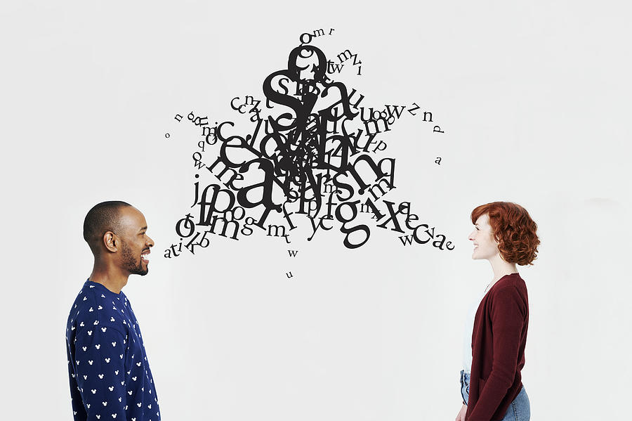 Man and woman with illustrated jumble of letters #1 Photograph by Plume Creative