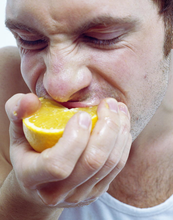 Juice Photograph - Man Eating Orange #1 by Jason Kelvin/science Photo Libray