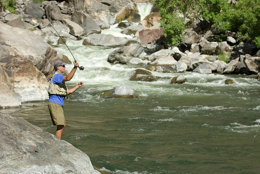 Man Fly Fishing In The Black Canyon Photograph by Kennan