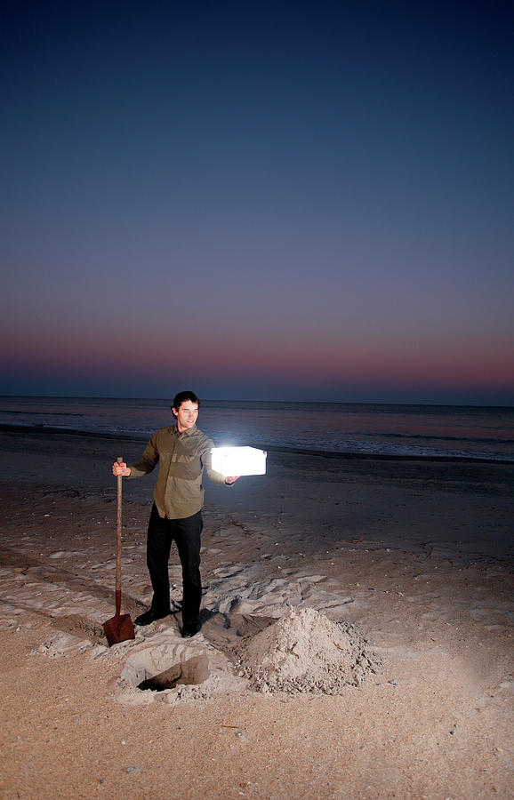 Sunset Photograph - Man Holds Glowing Box On Beach #1 by Logan Mock-Bunting