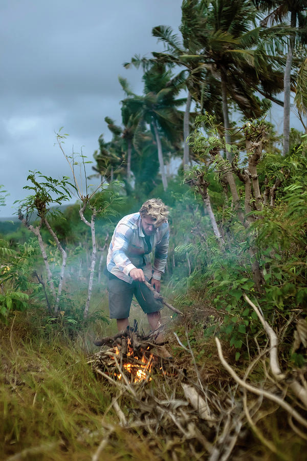 Nature Photograph - Man Near Campfire In Tropical Scenery #1 by Konstantin Trubavin